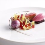 A piece of cake on a plate Description automatically generated