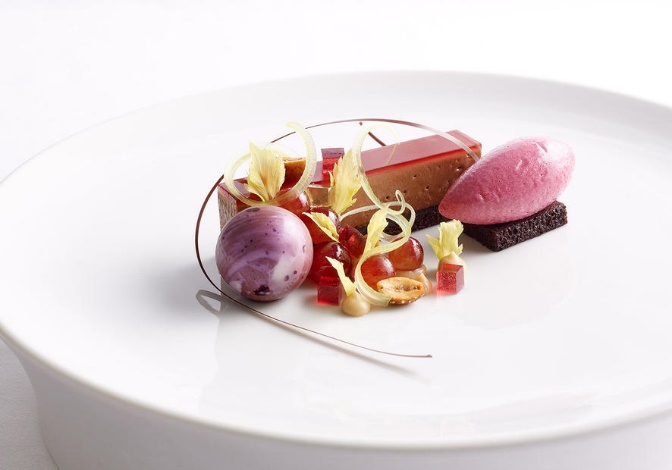 A piece of cake on a plate Description automatically generated